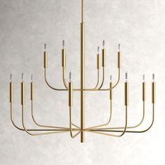 a brass chandelier with eight lights hanging from it's center, on a white wall