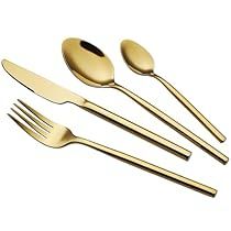 gold colored utensils and spoons on a white background