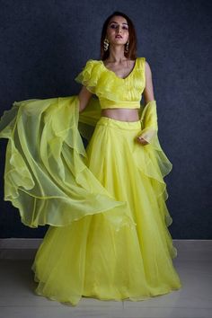 Lemon green organza lehenga. Paired with a pleated, padded and ruffle panel blouse with dupatta. - Aza Fashions Bollywood Style Ruffled Organza Pre-draped Saree, Fitted Organza Sets With Ruffles, Fitted Organza Set With Ruffles, Anarkali Sets With Ruffles In Georgette, Evening Organza Sets With Ruffles, Elegant Ruffled Organza Sharara, Green Organza Dress For Navratri, Green Ruffled Sharara With Traditional Drape, Anarkali Floor-length Sets With Ruffles