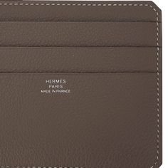 Guaranteed authentic Hermes 8CC Card Holder featured in Etoupe with White Topstitch.As part of the City line of cardholders, it is compact and lightweight.There are 8 slots for business and or credit cards inside.Neutral and beautiful in Evercolor calfskin.Comes with signature Hermes box.New or Store Fresh Condition. final saleCARD HOLDER MEASURES:LENGTH 4.7" TALL 3.3"CONDITION:New or Store Fresh Condition TIDS 'n BITSLightweight and slim, whether vertical or horizontal, this card holder is perf Luxury Bifold Card Holder For Daily Use, Luxury Business Wallets With Card Slots, Luxury Bifold Card Holder With Card Slots, Luxury Card Holder With Coin Pocket For Daily Use, Luxury Trifold Wallet With Card Slots For Business, Luxury Business Trifold Wallet With Card Slots, Luxury Compact Card Holder For Daily Use, Luxury Compact Trifold Wallet With Card Slots, Luxury Compact Card Holder For Business