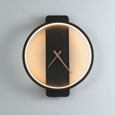 a clock that is on the wall with lights around it