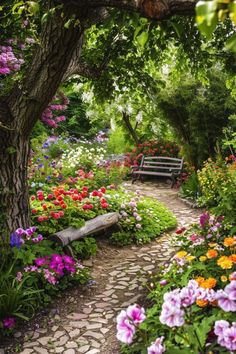 a garden with flowers and a bench in the middle