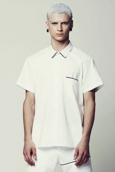 Mens Shirt // Unique Mens White Short Sleeve Button Down Dress Shirt by Eliran Nargassi has a minimalist design, a regular yet a bit slim fit silhouette through the body. Crafted in a high quality italian  cotton fabric; The shirt features one pocket to the chest with a black piping tape and also a classic button through placket with white buttons, a rounded hem and a classic collar with white piping tape.WE SHIP WORLDWIDE !The shirt is also available in Black: https://www.etsy.com/il-en/listing Bauhaus Shirt, Mens White Shirt, Mens White Trousers, Dress Shirt Short Sleeve, Men Minimalist Fashion, Mens White Dress Shirt, Black Dress Pants Men, Mens White Shorts, White Short Sleeve Dress