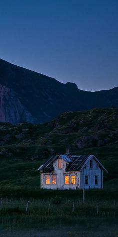 an old abandoned house in the mountains at night