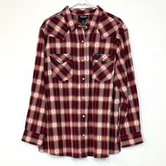 Embrace the cozy charm of the Wrangler Retro Plaid Flannel Shirt in a vibrant Biking Red that instantly elevates your casual wardrobe. This Modern Boyfriend-Fit Snap-Up Flannel is designed for the stylish woman who values both comfort and flair. With its soft, breathable fabric and eye-catching plaid pattern, this shirt is perfect for everything from outdoor adventures to cozy nights in. Feel the warmth and style wrap around you as you step out in confidence!Wrangler Retro Modern Boyfriend-Fit S Red Flannel Collared Shirt, Vintage Red Flannel Shirt, Red Vintage Flannel Shirt, Retro Red Button-up Flannel Shirt, Retro Plaid Button-up Flannel Shirt, Vintage Trucker Hats, Cozy Flannel, Plaid Flannel Shirt, Plaid Design