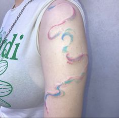 a woman with a tattoo on her arm