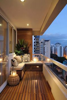 a balcony with wooden floors and lights on the outside, along with potted plants