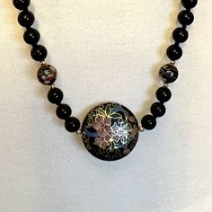 VINTAGE OVER-THE-HEAD CLOISONNE PENDANT NECKLACE. ROUND PENDANT IS 1.25 INCHES FOLLOWED BY 3 ONYX BEADS AND AND ONE ADDITION. PICS--More Treasures Here- https://www.etsy.com/shop/TreasureFoundToShare MARKDOWNS DAILY, SEE IT CHEAPER, WILL LOWER MY PRICE FULL REFUNDS TAKING BIDS AS OF FEBRUARY 2024 - Vintage Black Large Beads, Vintage Large Black Beads, Black Vintage Large Beads, Vintage Black Beaded Necklace With Large Beads, Vintage Black Beads For Gifts, Vintage Black Beads For Gift, Vintage Black Handmade Beaded Necklaces, Vintage Black Beads Necklace For Gift, Adjustable Black Vintage Beaded Necklace