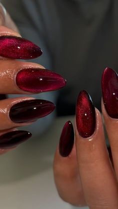 cherry cateye 🍒 #gelx #gelxnails #apres #apresgelx #nailinspo #gelxtech #naildesign #gelnails #nailart #nailsofinstagram #ontarionails #riversidenails #ranchocucamonganails #almondnails #rednails #cateyenails #cherrynails #blacknails #fallnails" Black Pink Red Nails, Black Cherry Cat Eye Nails, Red Almond Nails Acrylic, Nail Cherry Red, Cherry Coke Nails Chrome, Red Nails Metallic, Dark Red Shiny Nails, Jelly Red Cateye Nails, Cherry Cat Eye Nails