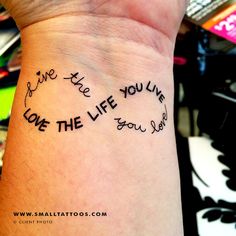 a woman's wrist with writing on it that says live the life you love