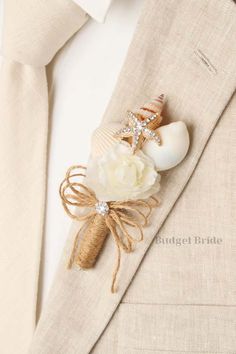 a boutonniere with seashells and starfish on the lapel