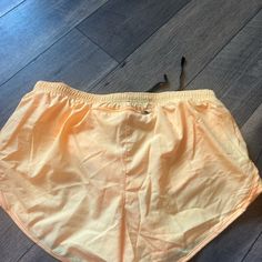 Color Light Orange Size L Never Worn Nike Summer Athletic Shorts With Pockets, Nike Athletic Shorts With Pockets For Summer, Nike Athletic Shorts For Spring, Nike Summer Workout Shorts, Nike Stretch Athletic Shorts For Beach, Nike Stretch Athletic Shorts For Summer, Nike Athletic Shorts For Summer, Nike Summer Athletic Shorts, Nike Beach Shorts With Pockets