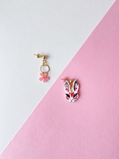 Unique and stylish earrings can be a wonderful gift for any Japan and anime enthusiast. The Bunny and Cherry Blossom flower are handcrafted from polymer clay. These earrings are created with special love and inspired by Asian culture. ◾Approx. total height of the bunny: 3 cm / 1.2 inches Approx. total height of the cherry blossom flower: 3.5 cm / 1.4 inches Approx. total height of the japanese fan: 3.5 cm / 1.4 inches I offer 4 earring set options: Asymmetrical - bunny + cherry blossom flower As Handmade Red Kawaii Jewelry, Unique Pink Flower Earrings For Gifts, Unique Pink Flower Earrings As Gift, Kawaii Polymer Clay Earrings For Gift, White Kawaii Polymer Clay Jewelry, Handmade Polymer Clay Kawaii Jewelry, Handmade Kawaii Polymer Clay Jewelry, Cute Polymer Clay Flower Earrings For Gifts, Kitsune Earrings