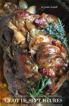 a close up of food in a pot with vegetables and meat on the side,