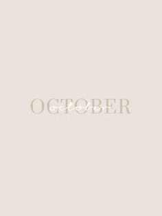 the word october written in white on a gray background