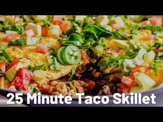 a close up of a plate of food with the words 25 minute taco skillet