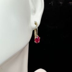 One Pair Of 14k Yellow Gold Lever Back Earrings, It Has A Natural Oval Shaped Ruby Prong Setting In The Front, 6 X 4.3mm, Combine Approx. 0.9ct. 14.4 X 12.6 X 4.2mm, Weight 1.1gm, Hallmark 1.1gm Yellow Gold Oval Earrings With Prong Setting, Yellow Gold Oval Earrings With Birthstone, Gold Yellow, Prong Setting, Hallmark, Ruby, Jewelry Earrings, Yellow Gold, Womens Sizes