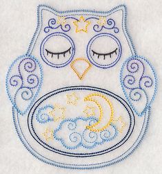 an embroidered owl with eyes and stars on it's face