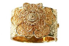 Vintage-style gold metal bracelet with center flower, based on a 1930's style bracelet. Measures 2-1/4" x 2-1/2" Grey Gardens® ships globally. For all international orders, please send us an email at info@greygardensofficial.com and we will invoice you directly via paypal. Gold Flower Heirloom Jewelry, Heirloom Gold Flower Jewelry, Heirloom Flower-shaped Gold Jewelry, Gold Flower Shaped Bracelets For Formal Occasions, Formal Gold Filigree Cuff Bracelet, Formal Gold Cuff Bracelet With Filigree, Ornate Gold Cuff Bracelet For Anniversary, Gold Filigree Cuff Bracelet For Formal Occasions, Gold Cuff Jewelry For Weddings