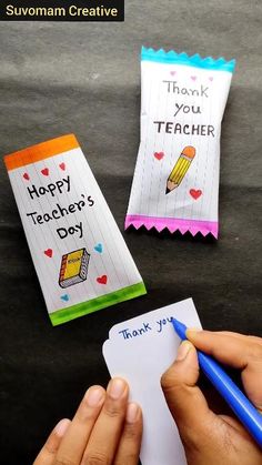 someone is writing thank you teacher's day cards