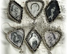 six framed pictures hang on a white lace doily in the shape of an ornament