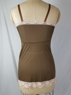 Good vintage condition Nylon At time of listing, two available. Marked 32 Bust 32 Waist 26 Hip 36 Length 22 Brown with light pink lace Fitted Lace Camisole With Built-in Bra, Fitted Coquette Camisole Tank Top, Coquette Fitted Tank Top With Spaghetti Straps, Fitted Lace Underbust Camisole, Fitted Lace Top Camisole In Coquette Style, Beige Fitted Camisole, Fitted Sleeveless Lace Camisole, Fitted Lace Camisole Sleeveless, Fitted Vintage Camisole