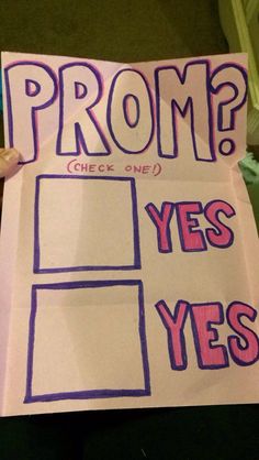 a person holding up a sign that says prom? check one, yes and yes