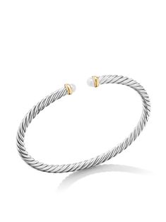 Find DAVID YURMAN 14kt Yellow Gold Modern Cable Pearl Bracelet on Editorialist. sterling silver 14kt yellow gold polished finish open cuff design twisted band freshwater pearl To ensure the shine and polish of your David Yurman piece, wash with a little non-bleach, soapy water and wipe clean with a soft cloth. Pearls should be the last thing that you put on in the morning and the first thing you take off at night. Avoid contact with perfumes or creams, and simply wipe with a soft cloth to clean. David Yurman Bracelet Stack, David Yurman Cable Bracelet, David Yurman Bracelet, Cuff Design, Bracelet In Silver, Cable Bracelets, Bracelet Pearl, Twisted Band, Band Bracelet