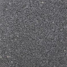 a black and gray surface with small rocks