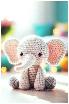 small crocheted elephant sitting on top of a table