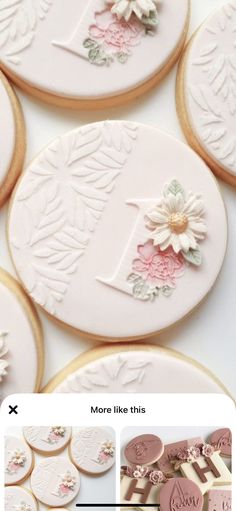 the cookies are decorated with pink and white flowers