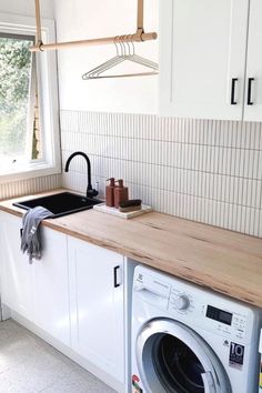 a washer and dryer in a small kitchen