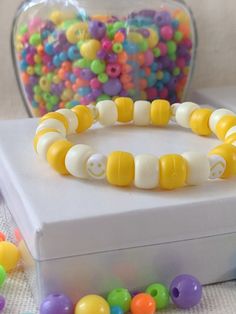 A nice mix of light and dark yellow beads with a smiley face pattern Cheerful Smiley Face Beaded Bracelets For Gifts, Yellow Smiley Face Beaded Bracelets For Gifts, Cheap Yellow Beaded Bracelet With Smiley Face, Yellow Beaded Bracelets With Smiley Face, Cheerful Smiley Face Beaded Bracelets, Playful Smiley Face Beaded Bracelets, Smiley Face Pattern, Smiley Bracelet, Smiley Face Bracelet