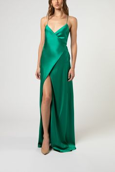 Full length wrap gown in pure silk satin. Features a low neckline, open back, and thin straps that tie at waist. Fully lined in silk. Imported.   Composition: 100% silk Green Silk Prom Dress, Emerald Green Silk Dress, Green Silk Dress, Silk Prom Dress, Green Silk Dresses, Perfect Cocktail Dress, Michelle Mason, Low Neckline, Silk Slip Dress