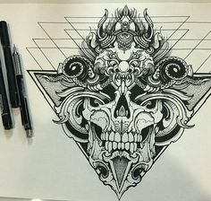 a drawing of a skull and triangle