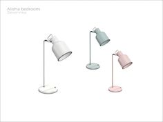 three different colored lamps sitting next to each other