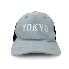 a hat with the word tokyo written on it in white and blue, against a white background