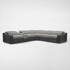 a large sectional couch with two reclinings on the back and one arm extended