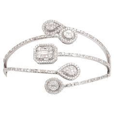 4.18 carats of white diamonds illusion set into pear, oval and emerald cut shapes. Set in 18k gold For a 6 - 7 inch wrist A beautiful gift! Diamond Bangle Bracelet, Marquise Shape Diamond, 18k Gold Bracelet, Expensive Jewelry Luxury, Modern Bracelets, Gold Jewelry Stores, Gem Diamonds, Bangle Bracelet Set, Diamond Bangles Bracelet