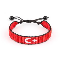 a red beaded bracelet with the letter e on it