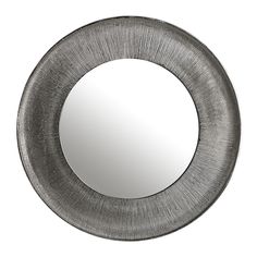 a round metal mirror on a white background