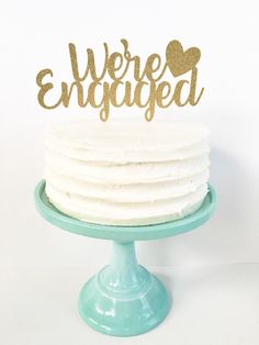 there is a cake that has been decorated with the words we're engaged