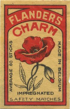 an old match card with a red flower on the front and bottom, says flanderss charm