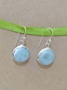 The Dominican Republic Natural Larimar Stone with Sterling Silver Dangle & Drop Earring. Natural Gemstone Earring For Her. It is a Larimar earring.  Authentic Rich looking earrings, vintage earrings, antique earrings The earring length is 25 mm. (ApproThe earring ring width is 13 mm (Approx.) Weight is 4 grams. (Approx.) Gemstone Shap:- Round Larimar is a rare gemstone only found in Dthe ominican Republic in the Caribbean. Larimar Healing Uses - Larimar is said to enlighten and heal in a physica Blue Larimar Dangle Jewelry, Blue Larimar Dangle Earrings, Larimar Dangle Earrings For Gifts, Blue Larimar Earrings For Gift, Round Larimar Jewelry Gift, Round Larimar Jewelry For Gifts, Silver Larimar Dangle Earrings, Silver Larimar Dangle Jewelry, Larimar Dangle Earrings As Gift