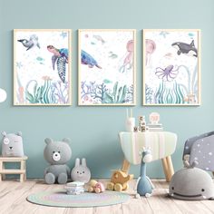 there are two pictures hanging on the wall in this room with animals and sea creatures