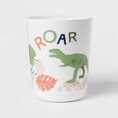 a mug with an image of a dinosaur on it's side and the words roar written