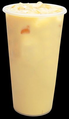 a yellow drink in a plastic cup on a black background