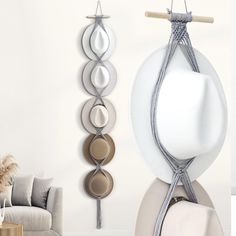 a white room with three different colored objects hanging on the wall