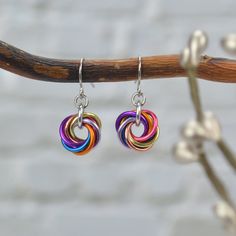 "Dainty Pride Earrings made in pink, peach, orange, pastel yellow, azure, lilac, and violet to best match the Xenogender Pride flag. 💗 aluminum links on stainless steel earwire  🧡 earring length approximately 1\" from top of earwire 💛 swirl is between 3/8\" - 1\" across  💙 rubber ear backs included 💜 Please see my shop for this same style earring in other flag colors, and feel free to send a request if you don't see what you're looking for. If you prefer sterling or hypoallergenic niobium e Xenogender Pride, Pride Earrings, Knot Earrings, Peach Orange, Pastel Yellow, Pink Peach, Flag Colors, Pride Flag, Pride Flags