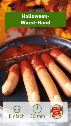 hot dogs on a plate with ketchup and mustard for halloween - wurst - hand